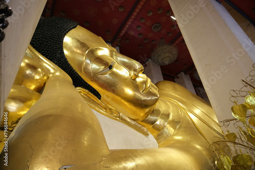 Phra Non Chakkrasi at Wat Phra Non Chakkrasi Worawihan is big gold reclining buddha statue. © Warida.lnnl