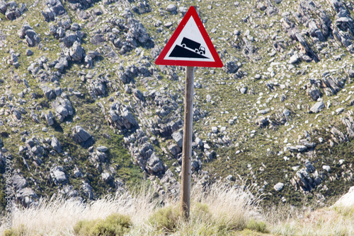 Warning sign of steep descent at the top of the Swartberg Pass, South Africa
