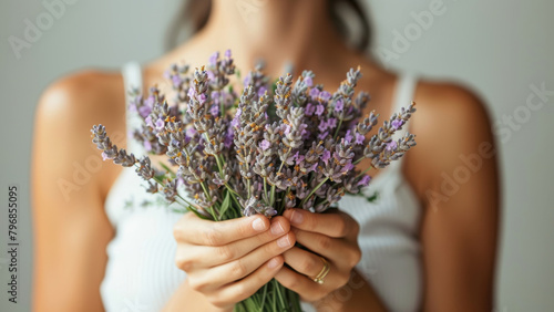 Lavender flowers in the hands of women.