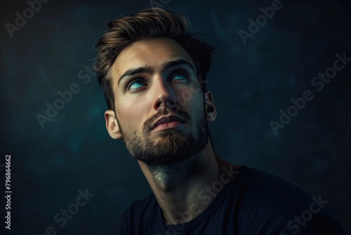 Portrait of handsome man in a studio on a dark background