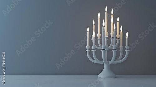 A beautiful lit menorah with white candles on a white table against a blue background. photo