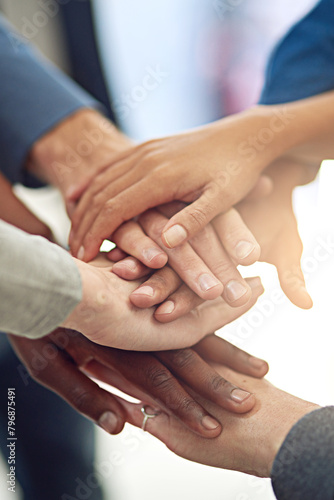 Business people, team and huddle for hands in stack, community and support or unity. Colleagues, pile and agreement in collaboration or alliance in workplace, solidarity and partnership in office