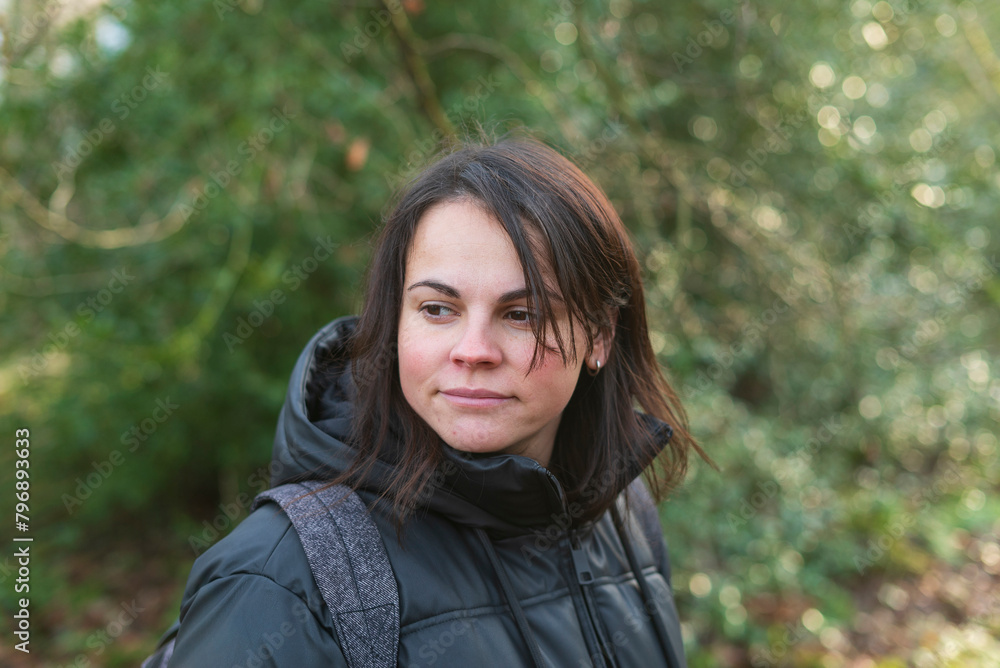 portrait of a young woman with backpack in the forest in autumn portrait of a young woman with backpack in the forest in autumn