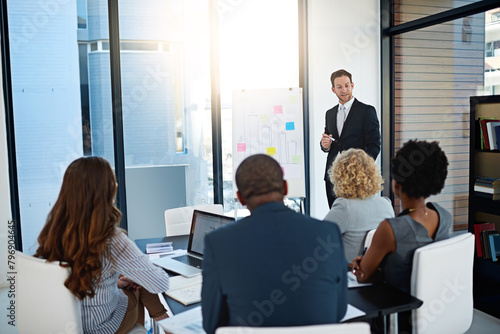 Board, businessman or speaker in presentation for teaching, advice or skill development in meeting. Group, workshop or leader talking in pitch, training or coaching for learning opportunity or ideas