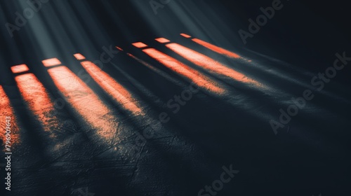   The sun illuminates a room with dark-hued walls and flooring Blinds allow sunlight to filter through, casting light onto the floor as curtains softly transmit this radiance photo