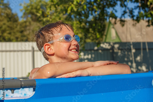 Happy boy in the pool. Swimming. An active lifestyle.