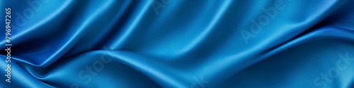 Blue panoramic silk background  fabric with blurred satin wavy texture.