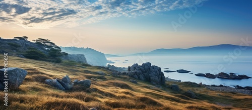 Grassy Hill  Rocks  Water View