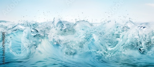 Wave crashing ocean with blue sky