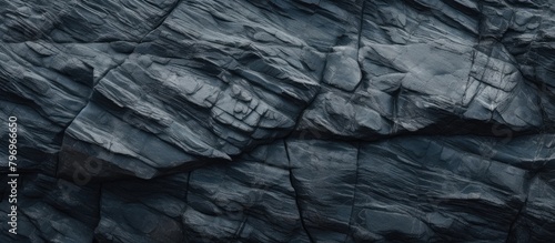 Rugged rock surface against dark backdrop