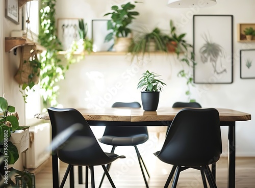 Modern scandinavian dining room interior with design wooden table black chairs and plants in elegant personal woman's home decor