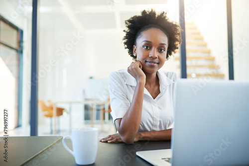 Portrait, laptop and black woman in office, smile and confidence for project, editor and corporate. Public relations, review and proofreading of articles, technology and online for company and web photo