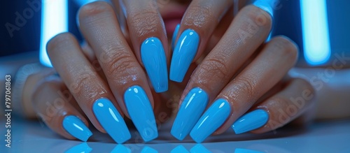 Womans Hands With Blue Nail Polish
