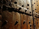 Ancient wooden door with iron studs