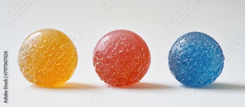 Three Different Colored Candies Arranged photo
