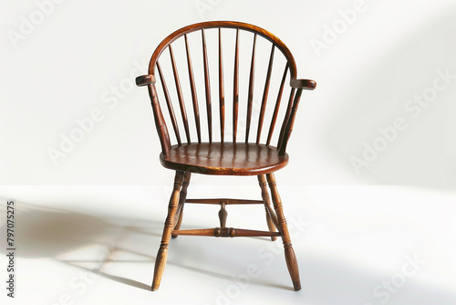 An antique Windsor chair displayed on a clean white background, isolated on solid white background.