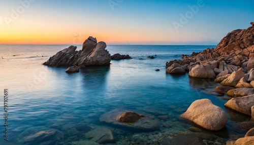 rocks in sea at sunset sardinia italy