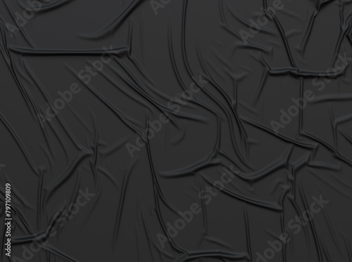 The black crumpled glued poster texture. Mockup of crumpled fabric or paper.