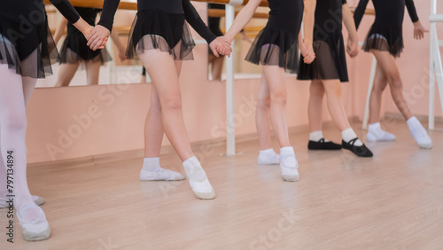 Close-up of five little girls' feet and ballet class. 