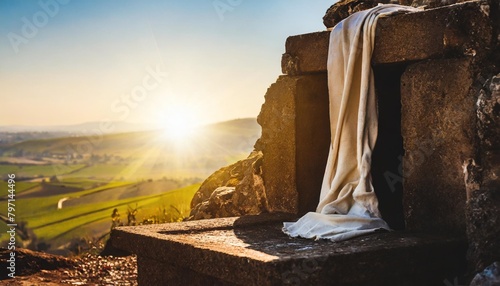 empty tomb with shroud in calvary hill christian easter concept resurrection of jesus christ at morning sunrise church worship salvation concept photo