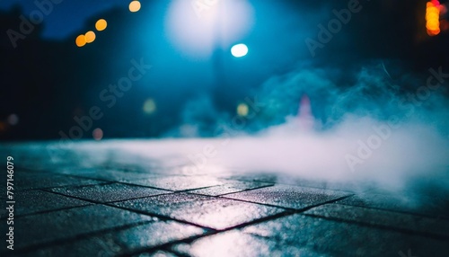 texture of a dark concrete floor with fog or mist set against a dark street backdrop with neon lights