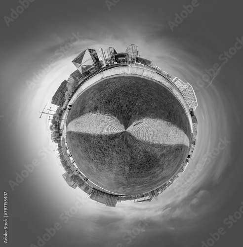 panorama of Spreebogen park in Berlin with government buildings in Berlin in early morning light in tiny planet format photo