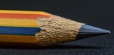 Close-up of a Sharpened Pencil on a Dark Background