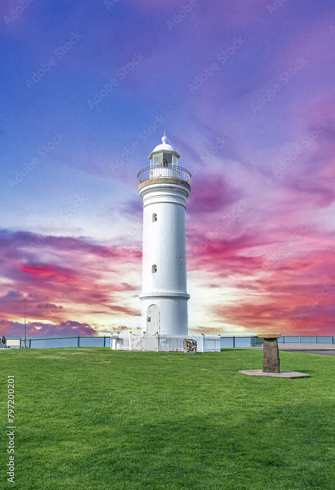 Beautiful lighthouse at Sunset over the Pacific Ocean on cliffs of Kiama Sydney NSW Australia Coastal Beach fishing Town