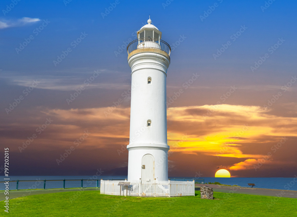 Beautiful lighthouse at Sunset over the Pacific Ocean on cliffs of Kiama Sydney NSW Australia Coastal Beach fishing Town Beautiful lighthouse at Sunset over the Pacific Ocean on cliffs of Kiama Sydney NSW Australia Coastal Beach fishing Town
