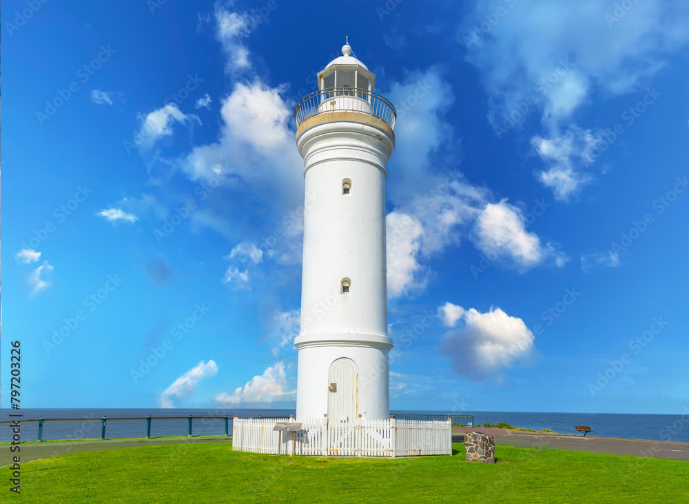 Beautiful lighthouse looking over the Pacific Ocean on cliffs of Kiama Sydney NSW Australia Coastal Beach fishing Town