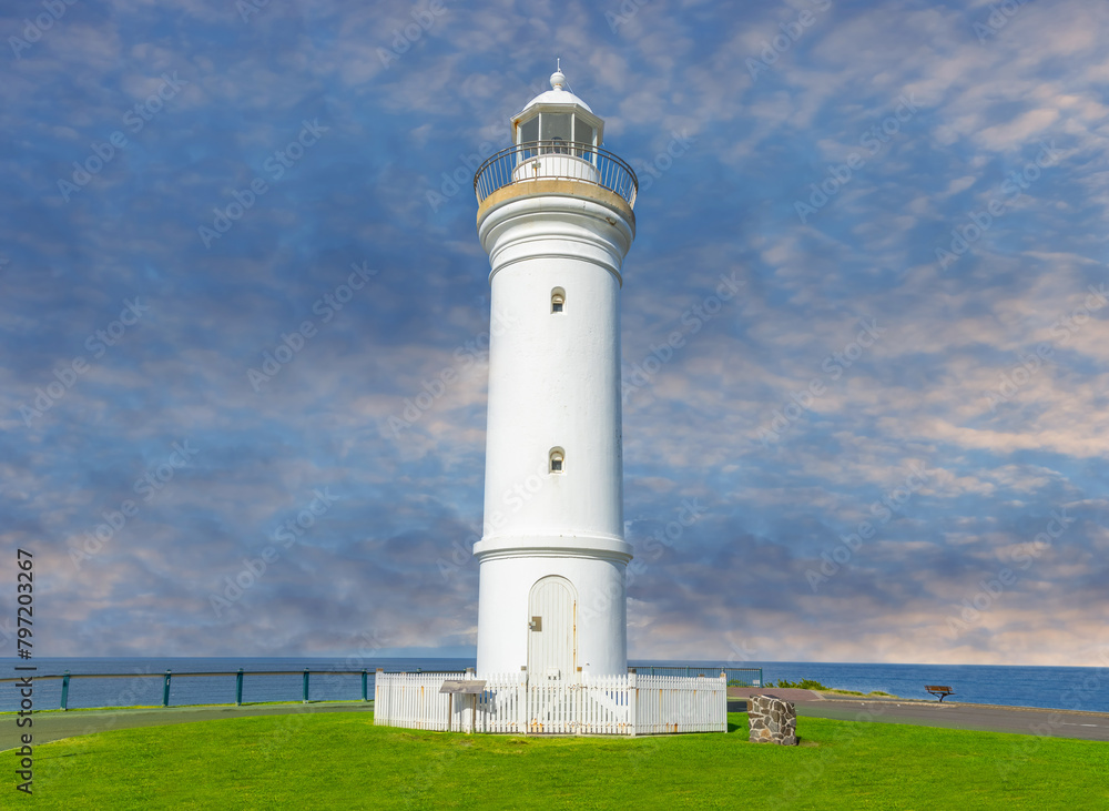 Beautiful lighthouse at Sunset over the Pacific Ocean on cliffs of Kiama Sydney NSW Australia Coastal Beach fishing Town