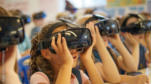Elementary school children wear virtual reality VR goggles headset technology.