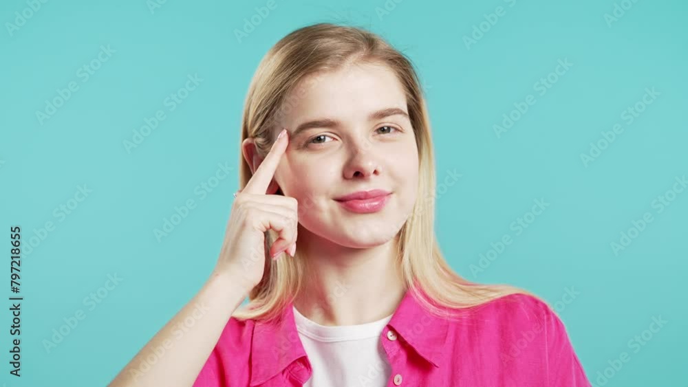 Pretty clever teenager girl with gesture - you, think about it. Looking camera on blue, smiling, positive intelligent person. Pretty clever teenager girl with gesture - you, think about it. Looking camera on blue, smiling, positive intelligent person.
