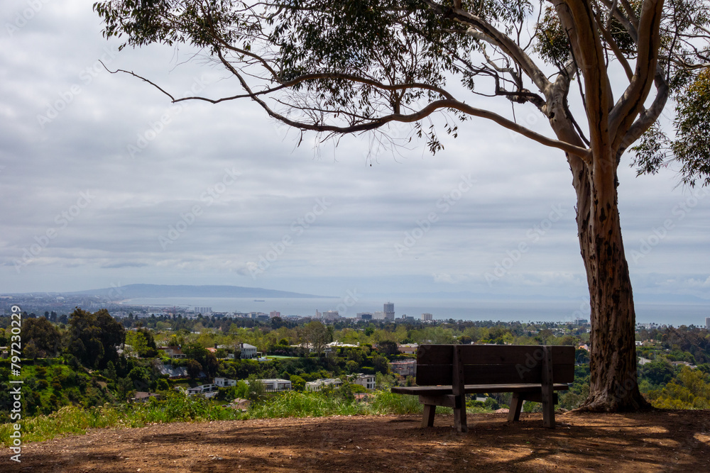 Bench overlooking Los Angeles and the pacific ocean in Will Rogers State Historic Park. Taken on an overcast spring morning.