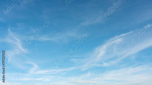 White clouds against a blue sky on a sunny day.