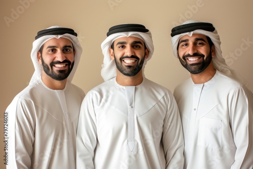 3 Middle eastern men in thawb portrait smiling people. photo
