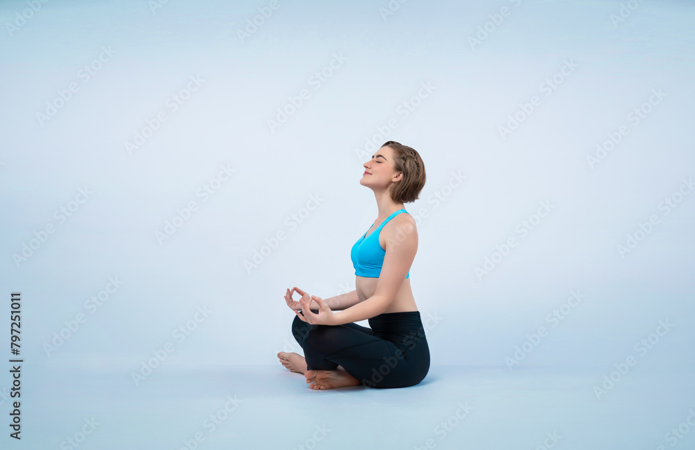 Full body length gaiety shot athletic and sporty woman doing healthy and meditative yoga exercise workout posture on isolated background. Healthy active and body care lifestyle