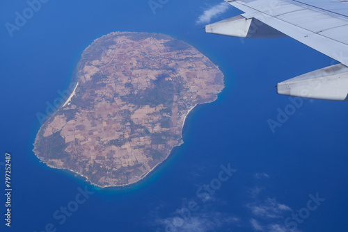 Breathtaking views captured from above: a lonely island and a mesmerizing world of clouds and landscapes opens through an aerial camera lens