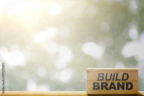 Wooden block with build brand text