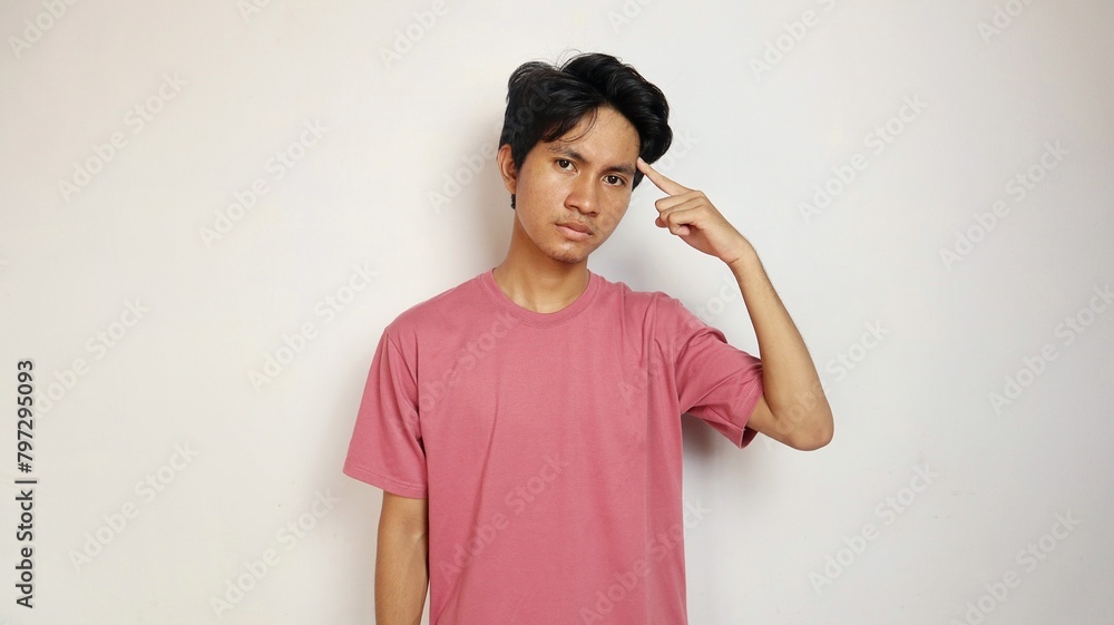 young asian man posing thinking about something on an isolated white background