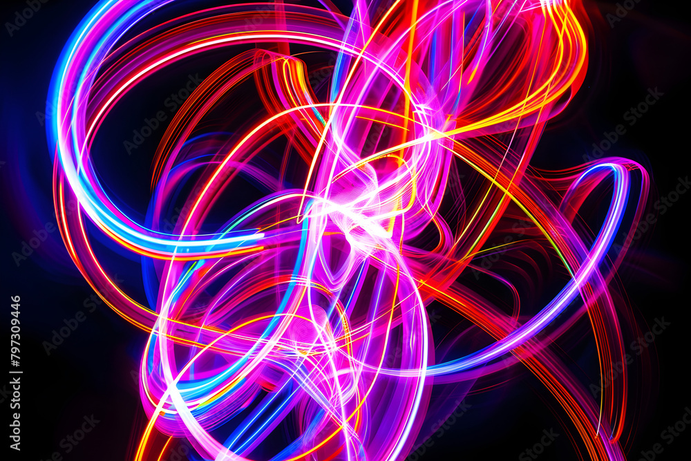Hypnotic and energetic radiant neon lines dancing in a symphony of colors. Mesmerizing artwork on black background.