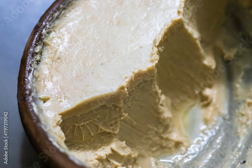 mishti doi or dahi or sweet yogurt being served earthen bowl. This fermented curd is very popular dessert in west bengal, bangladesh & tripura. It is made of milk and jaggery. photo