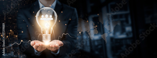 Human Resource: Creativity, Empowerment concept. Hands of businessman holding light bulb and Human Resource Icon with data network digital technology. Leveraging Talent for Organizational Growth. photo