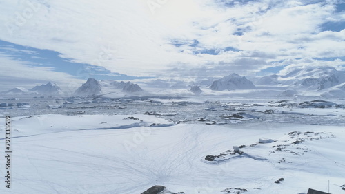 Antarctic Vernadsky Station Majestic Aerial View. Ocean Coast Frozen Water Surface. South Pole Settlement Base Mountain Peninsula Landscape Drone Flight