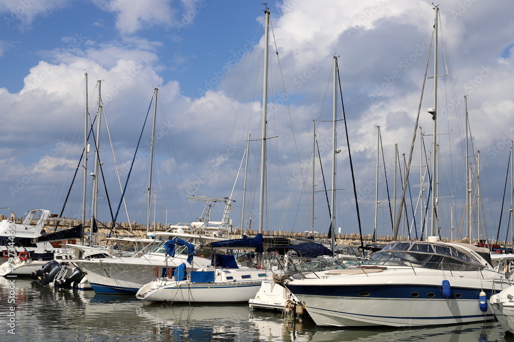 Masts in the port against the blue sky. Masts in the port against the blue sky.