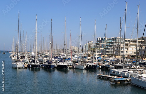 Masts in the port against the blue sky. © shimon