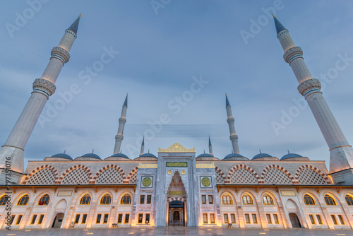 Sunset shot of Grand Camlia Mosque, or Buyuk Camlica Camii, a modern Islamic complex, built in 2019, located in Camlica hill in Uskudar district, Istanbul, Turkey photo