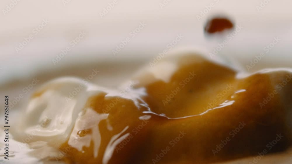 Hot espresso dripping onto vanilla gelato Hot espresso dripping onto vanilla gelato