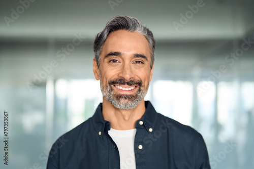 Happy middle aged 50 years old professional business man, smiling older executive manager, mature bearded businessman entrepreneur standing in office at work looking at camera, headshot portrait.