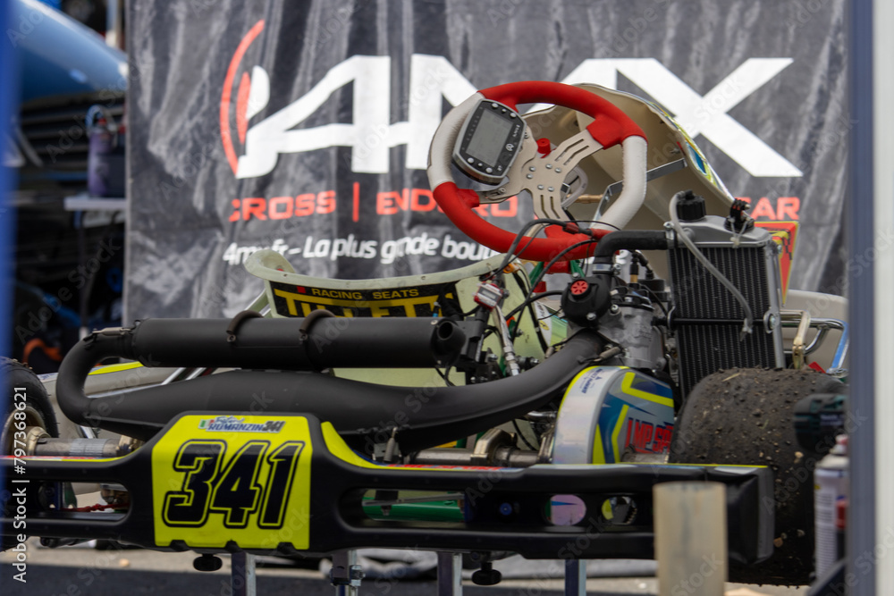 France, April 14, 2024 Closeup of a competitive gokart on the track, showcasing its design